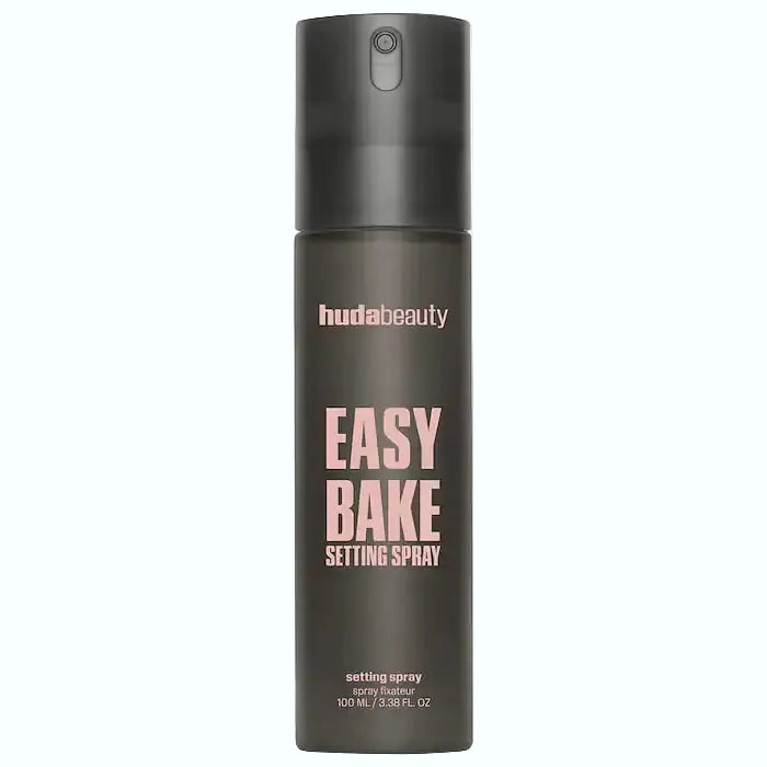 Huda Beauty Easy Bake Setting Spray blurs pores and locks makeup for 16 hours with non-drying formula